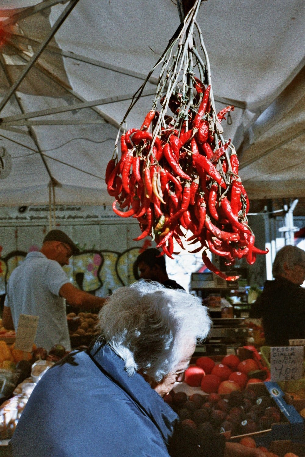 Film photo: dried chilies hanging at a market stall