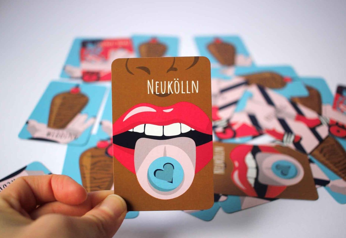 Printed Neukölln card in hand