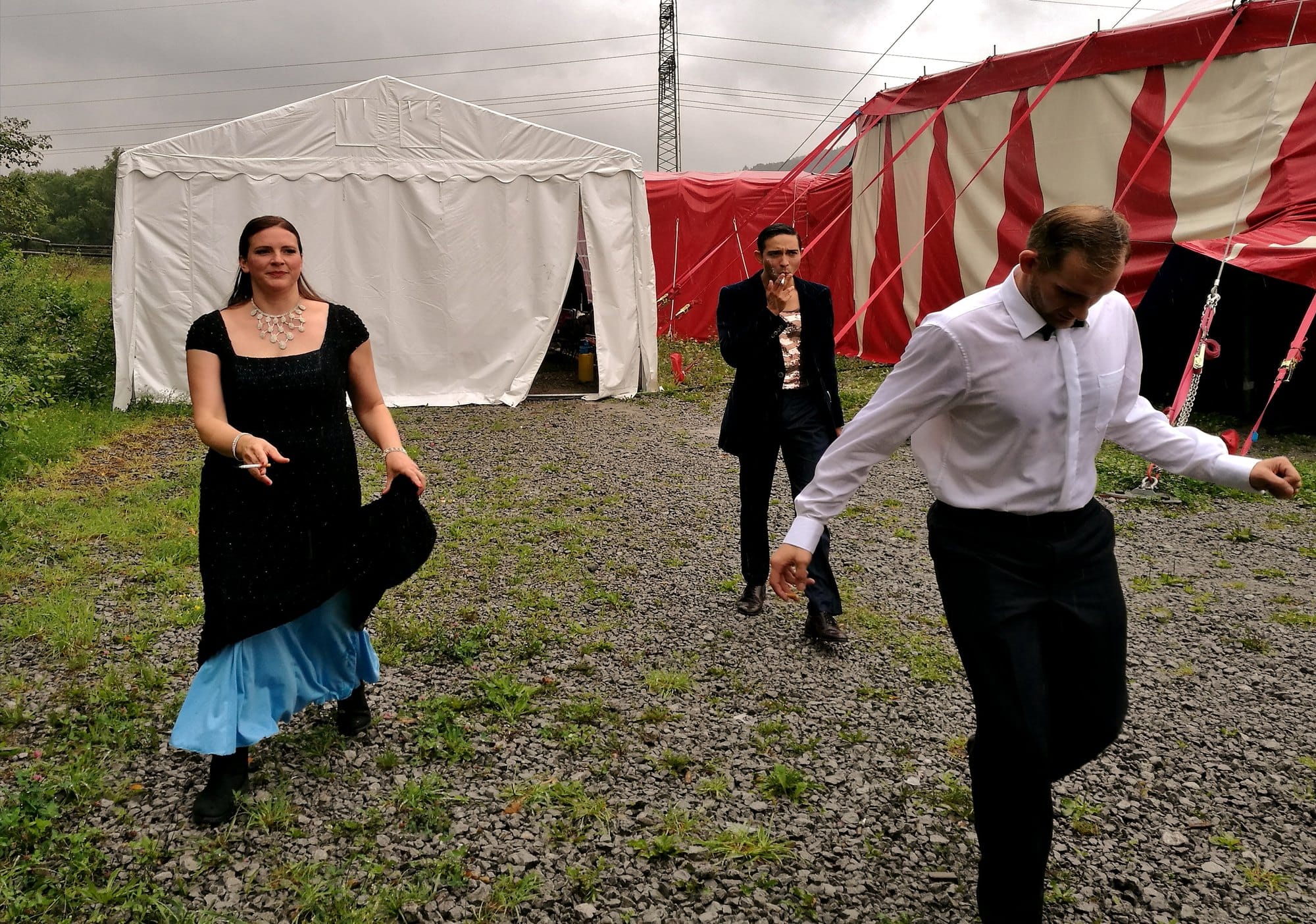 Actors between the tents backstage