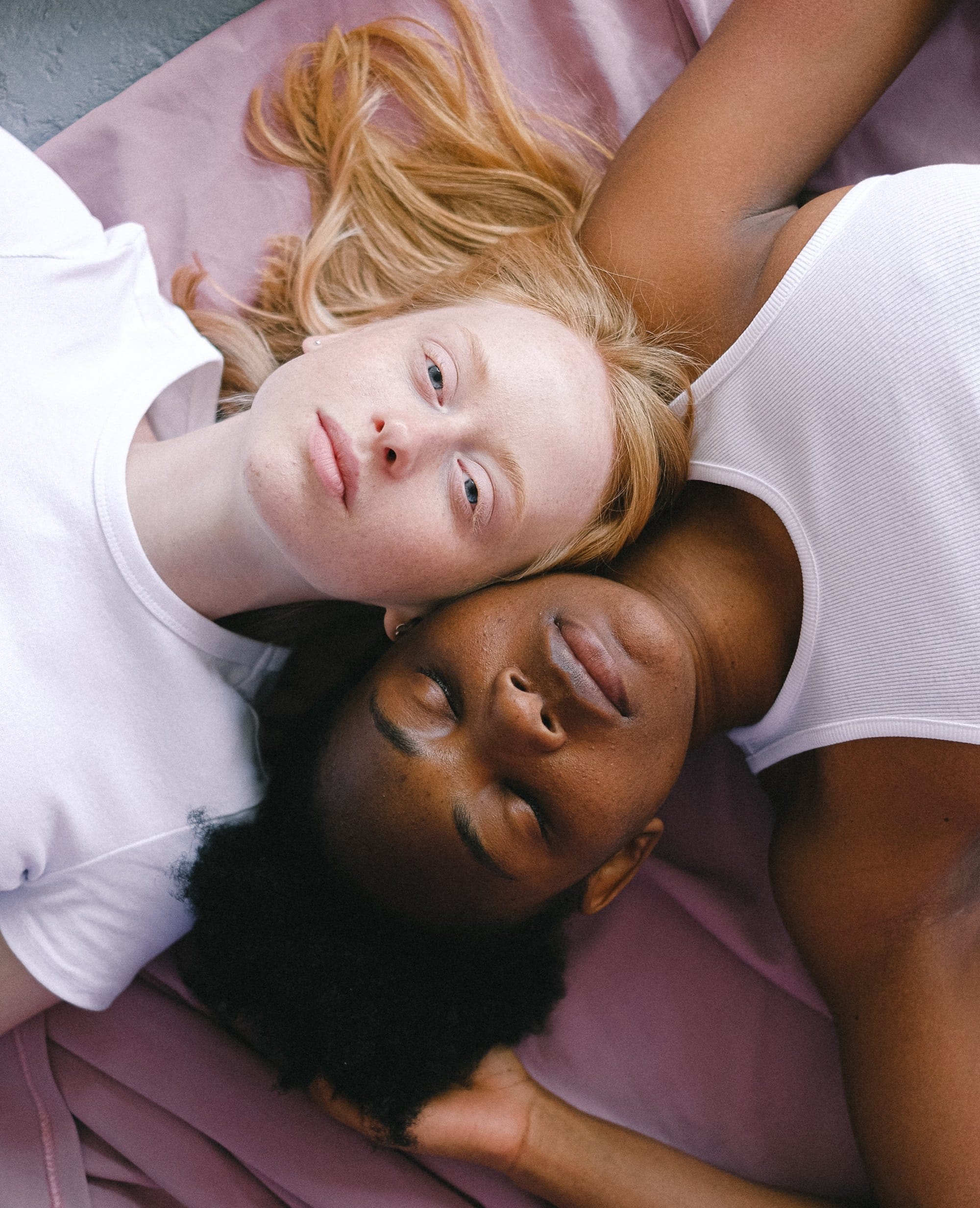Brand imagery: two people lying head to head