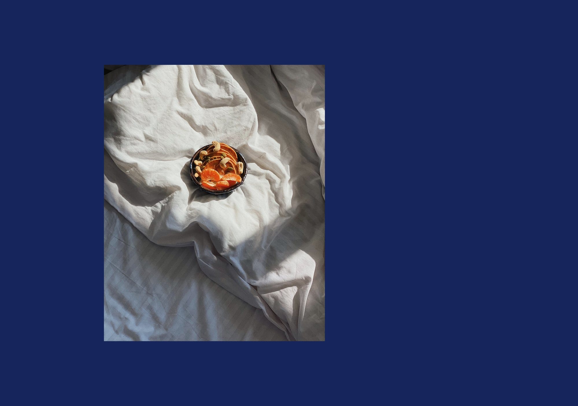 Brand imagery: breakfast bowl on white sheets